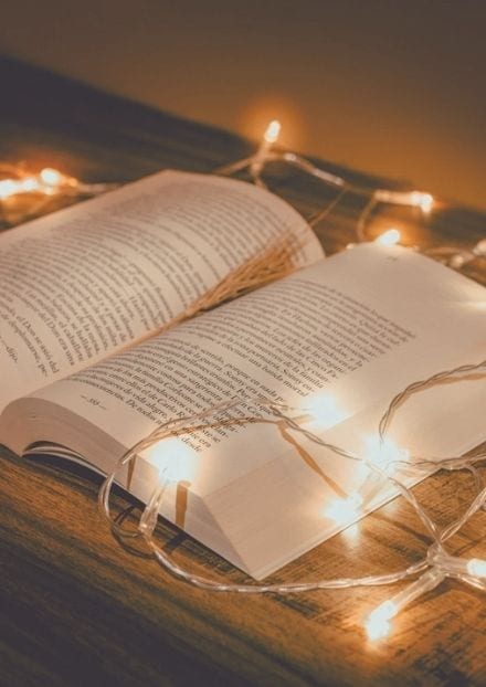 open books with fairy lights