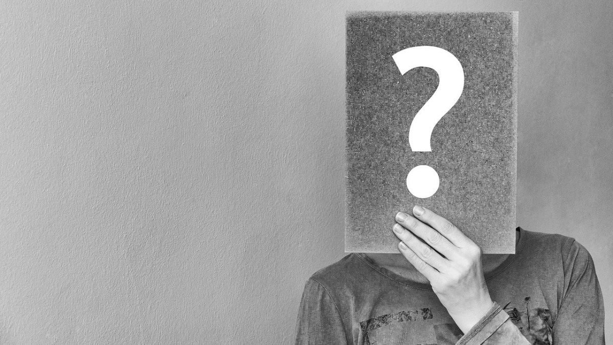 Question mark sing hiding a face greyscale