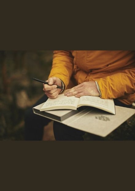 Person writing in journal